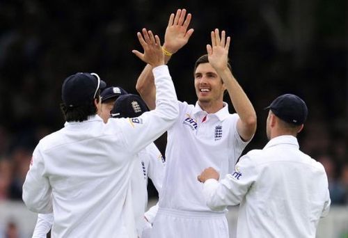 England's Steven Finn celebrates taking the wicket of New Zealand's BJ Watling at Lord's on May 18, 2013