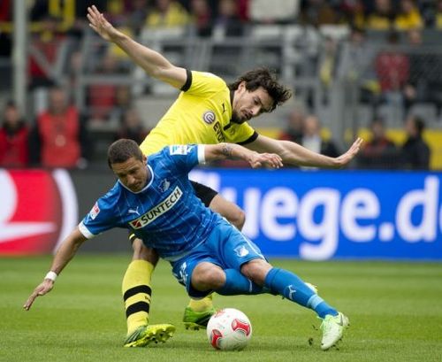 Dortmund's Mats Hummels (R) and Hoffenheim's Sejad Salihovic fight for the ball in Dortmund on May 18, 2013