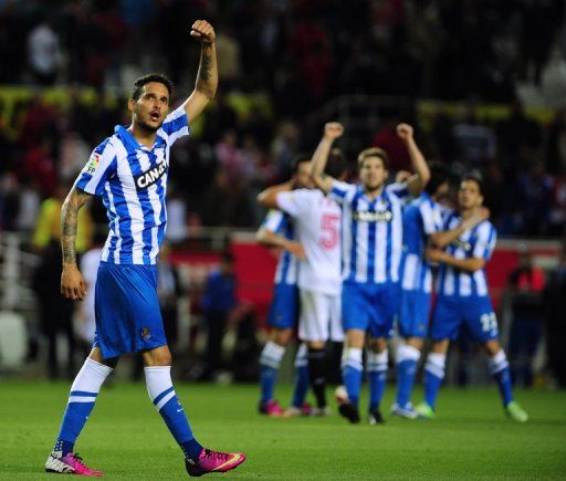 Real Sociedad&#039;s Liassine Cadamuro-Bentaiba (L) celebrates win against Sevilla, on May 18, 2013