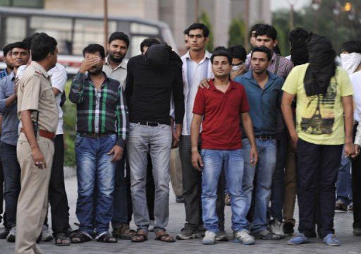 Arrested bookmakers and Indian cricketers are brought to court in New Delhi on May 16, 2013