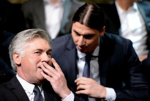 Carlo Ancelotti (L) speaks with Paris Saint-Germain striker Zlatan Ibrahimovic in Paris on May 19, 2013