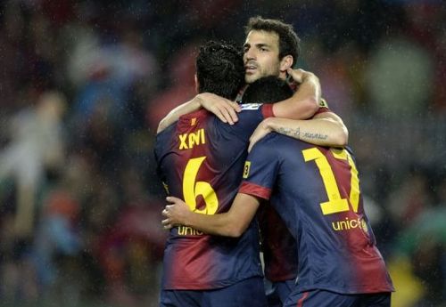 Barcelona's Pedro Rodriguez (R), Xavi Hernandez (L) and Cesc Fabregas (C) celebrate on May 19, 2013 at Camp Nou stadium