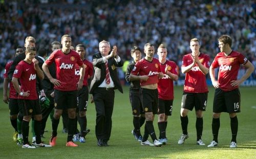 Manchester United's Alex Ferguson and his players greet the crowd after their match against West Brom on May 19, 2013