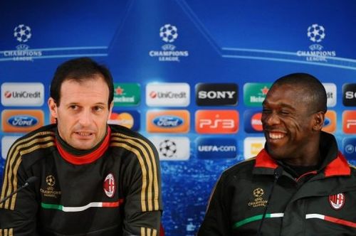 AC Milan's Massimiliano Allegri (left) and Clarence Seedorf speak on eve of match against Barcelona on November 22, 2011