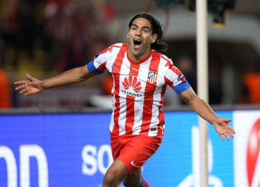 Atletico Madrid&#039;s Radamel Falcao celebrates after scoring against Chelsea during the UEFA Super Cup on August 31, 2012