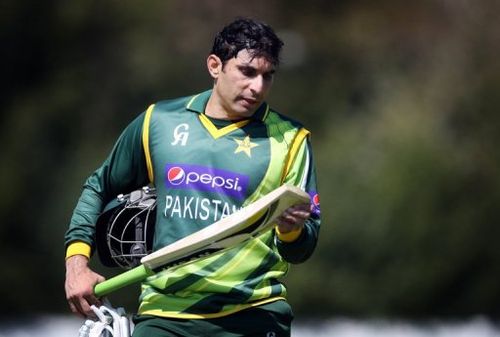 Pakistan's Misbah-ul-Haq inspects hi bat during the one-day match against Scotland in Edinburgh, on May 17, 2013