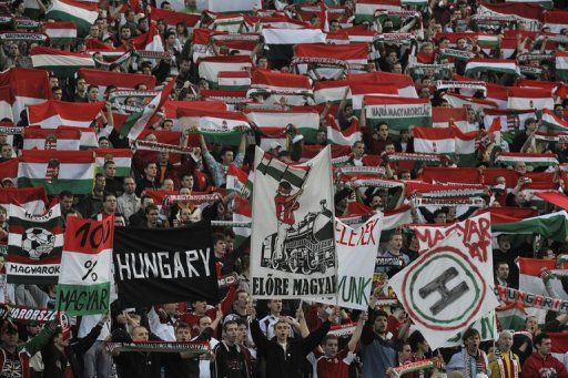 Hungarian fans celebrate at Puskas stadium of Budapest on April 1, 2009