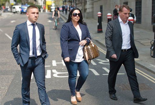 Footballer Anton Rodgers (L) with his father Liverpool manager Brendan Rodgers (R)  in London, on May 7, 2013