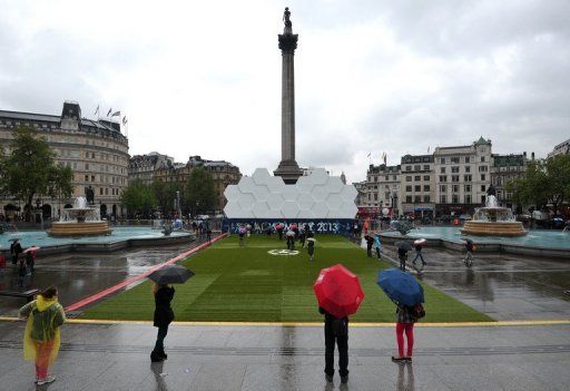 People visit the Champions League fan zone in Trafalgar Square in central London on May 24, 2013