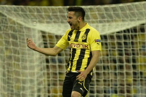 Borussia Dortmund&#039;s midfielder Ilkay Gundogan celebrates scoring his penalty at Wembley Stadium in London, May 25, 2013