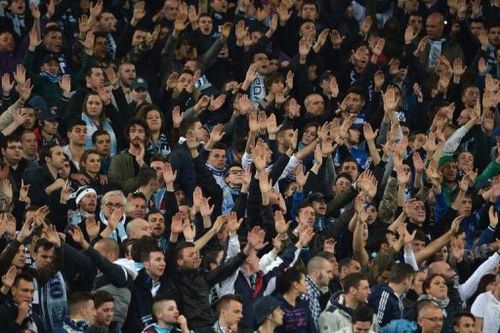 Lazio' fans cheer their team during the match against AS Roma Rome on April 8, 2013 at the Olympic stadium in Rome