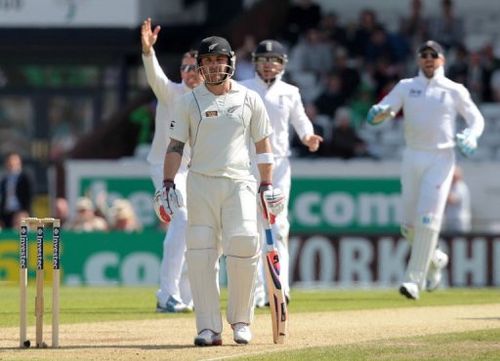 Doug Bracewell walks after being caught by England's Ian Bell off Graeme Swann's bowling in Leeds on May 26, 2013