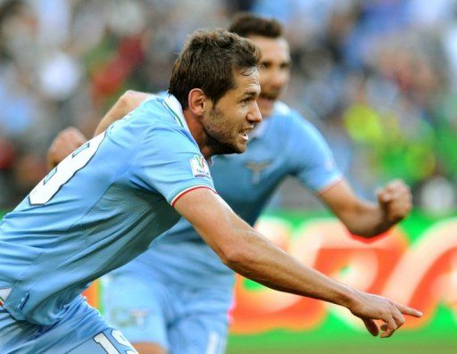 Lazio&#039;s Senad Lulic (L) celebrates after scoring at the Olympic Stadium in Rome on May 26, 2013