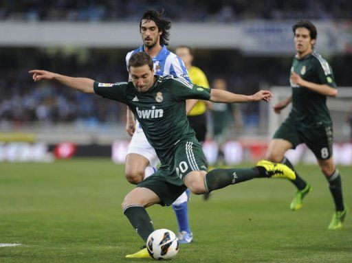 Real Madrid&#039;s Gonzalo Higuain kicks the ball at Anoeta stadium in San Sebastian on May 26, 2013