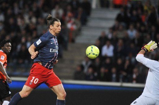 Paris Saint-Germain&#039;s Zlatan Ibrahimovic scores on May 26, 2013 at the Moustoir stadium