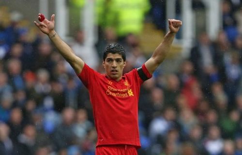 Luis Suarez reacts at The Madejski Stadium in Reading, southern England on April 13, 2013