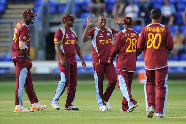  West Indies celebrate after Denesh Ramdin caught out Australia&#039;s Matthew Wade during the West Indies v Australia - ICC Champions Trophy Warm Up match at the SWALEC Stadium on June 1, 2013 in Cardiff, Wales.