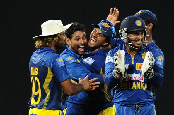 Sri Lankan cricketers celebrate the dismissal of AB de Villiers during the second ODIat the R. Premadasa Stadium in Colombo on July 23, 2013. (Getty Images)