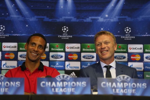 Manchester United manager David Moyes and player Rio Ferdinand in good spirits as they both answer questions from the media during a press conference ahead of their UEFA Champions League match against Bayer Leverkusen at Old Trafford on September 16, 2013 in Manchester, England.  (Getty Images)