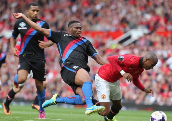 Ashley Young of Manchester United clashes with Kagisho Dikgacoi of Crystal Palace 