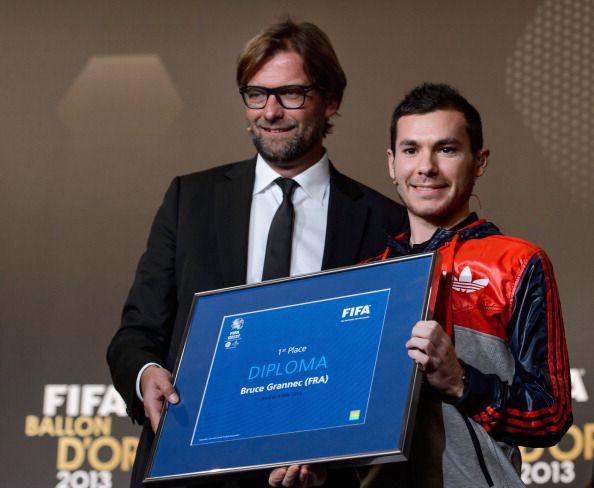 French Bruce The Machine Grannec poses with his diploma with Borussia Dortmund's German coach Jurgen Klopp