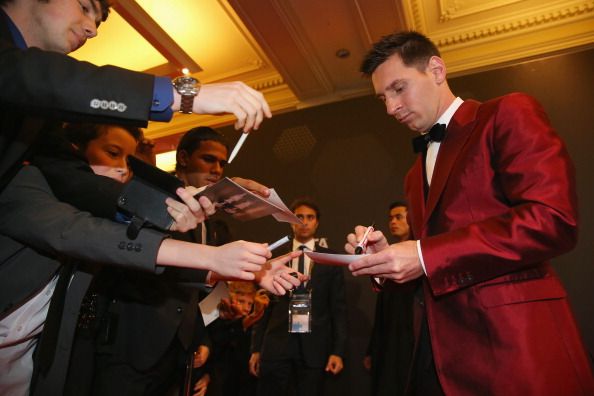 FIFA Ballon d'Or nominee Lionel Messi of Argentina and Barcelona signs autographs