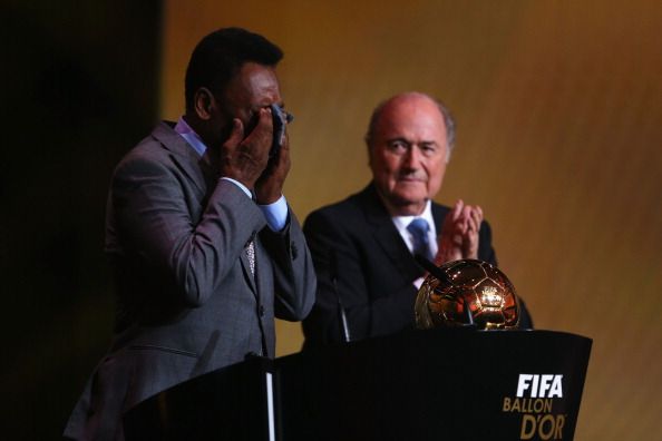 Pele of Brazil wipes tears from his eyes after receiving the FIFA Ballon d'Or Prix d'Honneur award