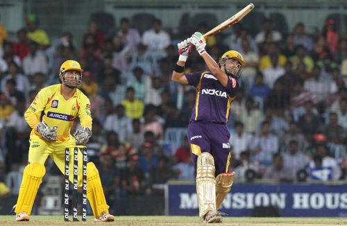 Kolkatta Knight Riders batsman Gautam Gambhir is watched by Chennai Super Kings wicketkeeper Mahendra Singh Dhoni as he plays a stroke during the IPL Twenty20 cricket match between Chennai Super Kings and Kolkatta Knight Riders at The M.A.Chidambaram Stadium in Chennai on April 30, 2012.    RESTRICTED TO EDITORIAL USE. MOBILE USE WITHIN NEWS PACKAGE  AFP PHOTO/Seshadri SUKUMAR