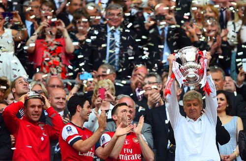 Arsenal celebrate their FA Cup victory as they lift the trophy