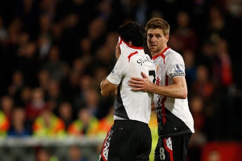 Liverpool captain Steven Gerrard consoles Luis Suarez 