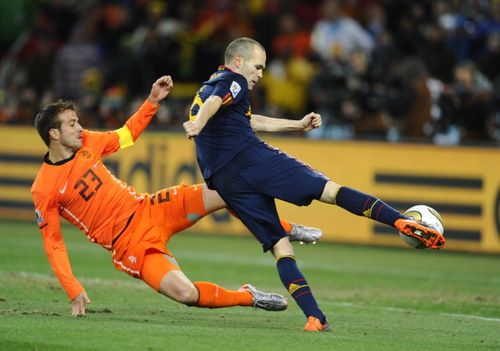 Spain's midfielder AndrÃ©s Iniesta (R) shoots and scores a goal during extra time the 2010 FIFA football World Cup final between the Netherlands and Spain on July 11, 2010 at Soccer City stadium.