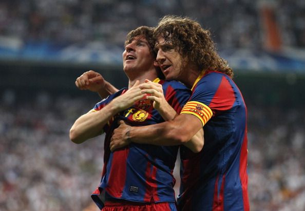 Carles Puyol and Messi