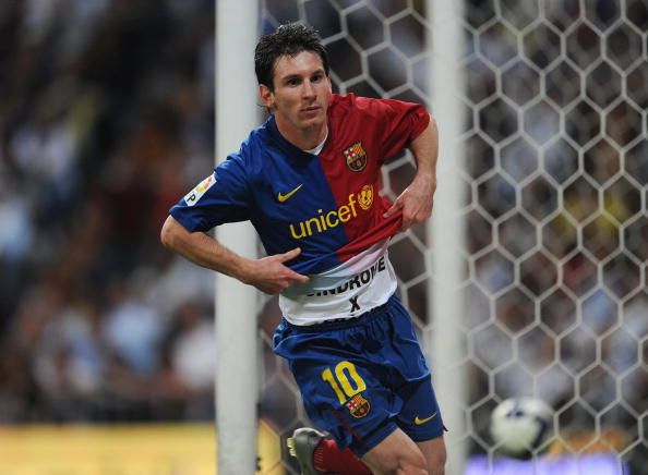 Lionel Messi celebrates scoring his Barcelonas fifth goal against Real Madrid at the Santiago Bernabeu