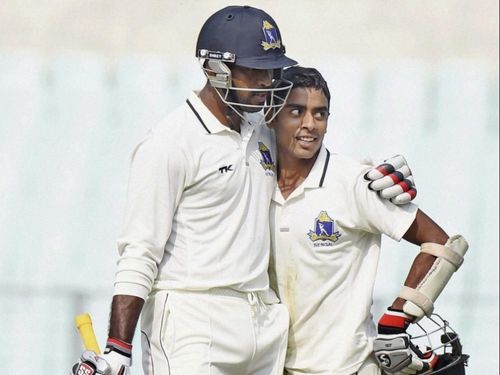 Abhimanyu Easwaran celebrates a Ranji century against Tamil Nadu with Saurashish Lahiri earlier in 2015