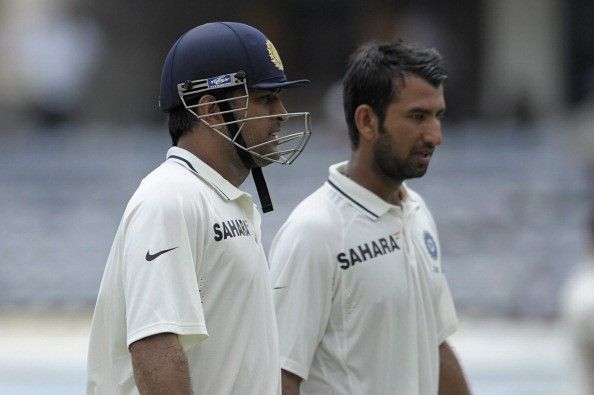 Dhoni (L) showed confidence in Pujara (R) to send the latter to bat at Number 3