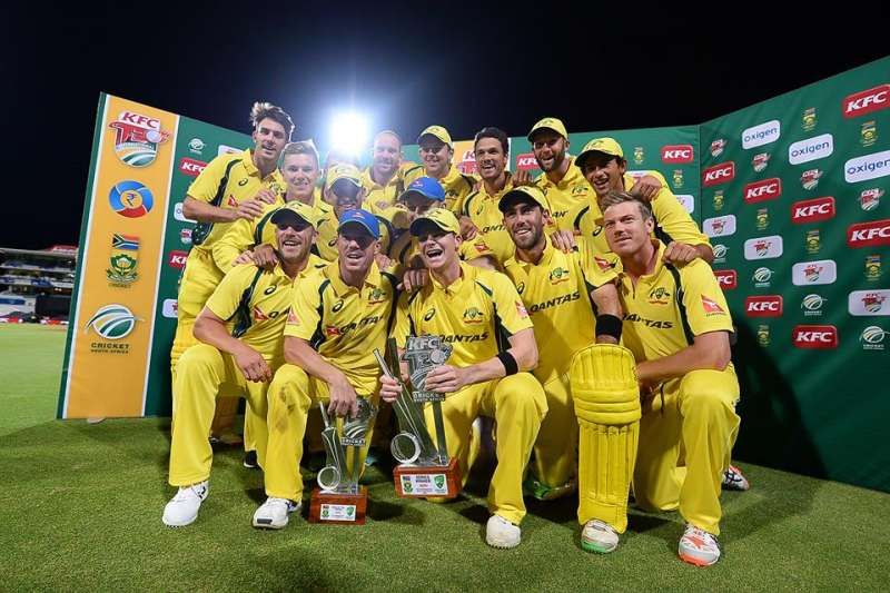 Australian cricket team pose with the trophy
