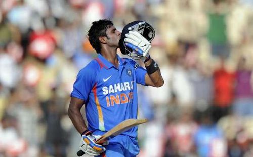 Manoj Tiwary celebrates his century against the West Indies.