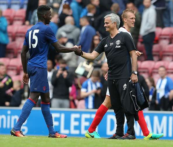 Axel Tuanzebe with Jose Mourinho after the game against Wigan