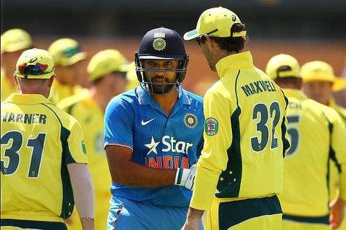 Australian players congratulate Rohit Sharma of India at the end of the innings