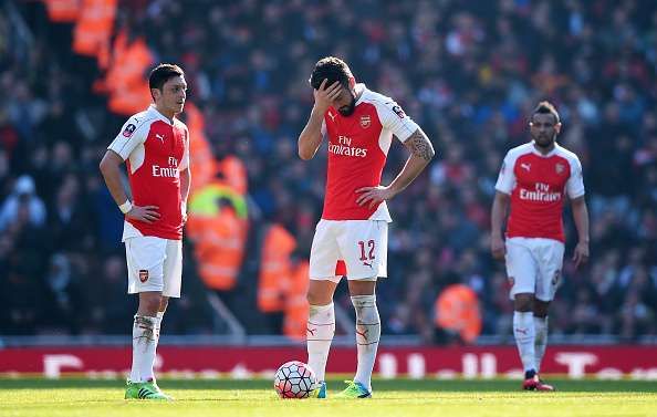 LONDON, ENGLAND - MARCH 13:  Olivier Giroud (12) and Mesut Ozil (11) of Arsenal look dejected as Adlene Guedioura of Watford scores their second goal during the Emirates FA Cup sixth round match between Arsenal and Watford at Emirates Stadium on March 13, 2016 in London, England.  (Photo by Shaun Botterill/Getty Images)