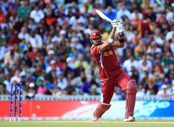 LONDON, ENGLAND - JUNE 07:  Kieron Pollard of West Indies hits the ball to the boundary during the ICC Champions Trophy group B match between West Indies and Pakistan at The Oval on June 7, 2013 in London, England.  (Photo by Richard Heathcote/Getty Images)