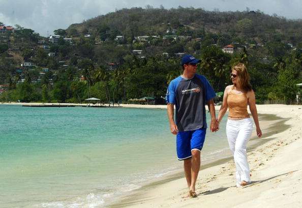 ST. GEORGE'S, GRENADA - MAY 29:  Glenn McGrath of Australia with wife Jane on May 29, 2003 on the beach in St. George's, Grenada.  (Photo by Hamish Blair/Getty Images) 