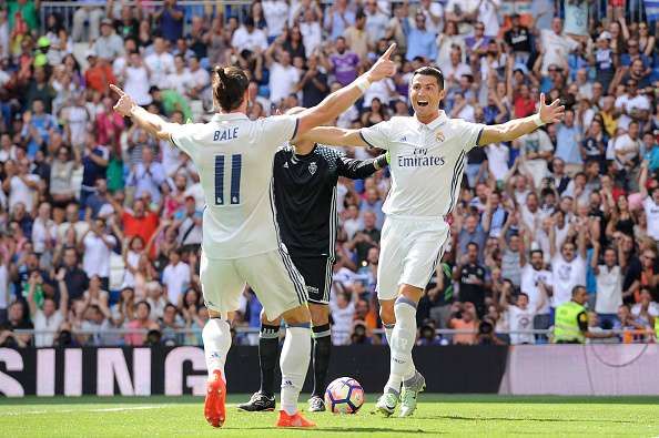 MADRID, SPAIN - SEPTEMBER 10:    Cristiano Ronaldo of Real Madrid celebrates with Gareth Bale after scoring opening goal during the La Liga match between Real Madrid CF and CA Osasuna at Estadio Santiago Bernabeu on September 10, 2016 in Madrid, Spain.  (Photo by Denis Doyle/Getty Images)