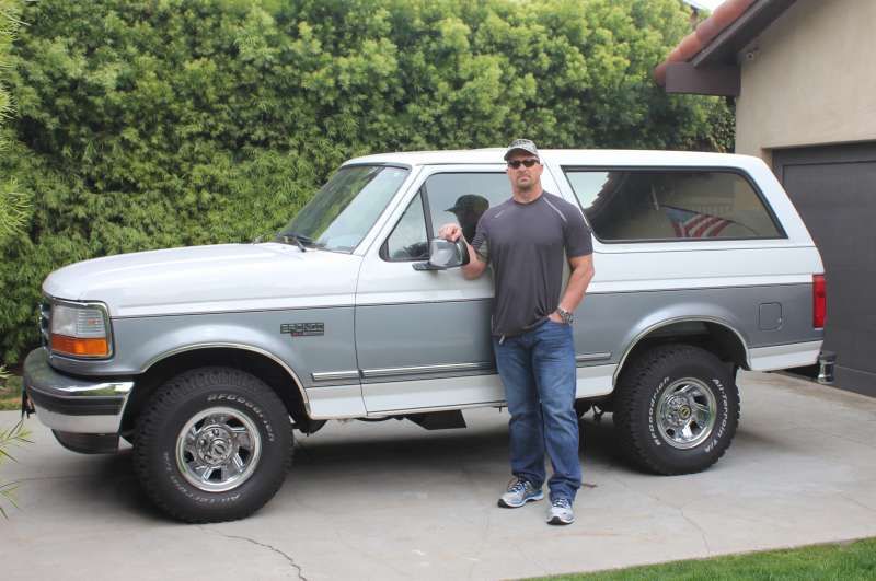 Austin posing with his 1995 Ford Bronco