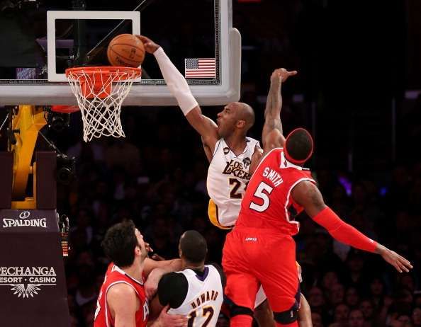 LOS ANGELES, CA - MARCH 03:  Kobe Bryant #24 of the Los Angeles Lakers dunks over Josh Smith #5 of the Atlanta Hawks at Staples Center on March 3, 2013 in Los Angeles, California. The Lakers won 99-98. NOTE TO USER: User expressly acknowledges and agrees that, by downloading and or using this photograph, User is consenting to the terms and conditions of the Getty Images License Agreement.  (Photo by Stephen Dunn/Getty Images)