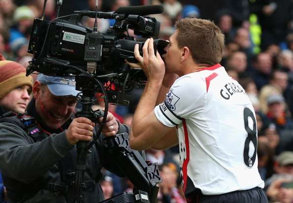MANCHESTER, ENGLAND - MARCH 16:  Steven Gerrard of Liverpool celebrates scoring the second goal by kissing the steadicam during the Barclays Premier League match between Manchester United and Liverpool at Old Trafford on March 16, 2014 in Manchester, England.  (Photo by Alex Livesey/Getty Images)