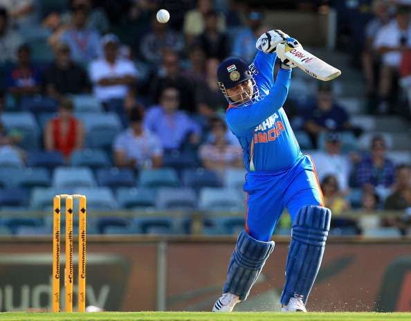 PERTH, AUSTRALIA - FEBRUARY 08:  Virender Sehwag of India drives for four during the One Day International match between India and Sri Lanka at WACA on February 8, 2012 in Perth, Australia.  (Photo by Hamish Blair/Getty Images)