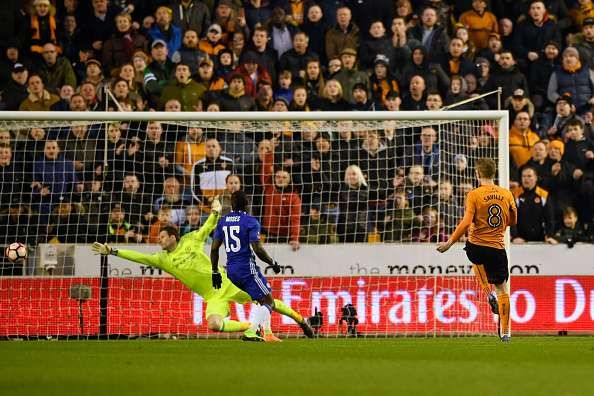 WOLVERHAMPTON, ENGLAND - FEBRUARY 18: George Saville of Wolves (R) shoots and hits the post during The Emirates FA Cup Fifth Round match between Wolverhampton Wanderers and Chelsea at Molineux on February 18, 2017 in Wolverhampton, England.  (Photo by Stu Forster/Getty Images)