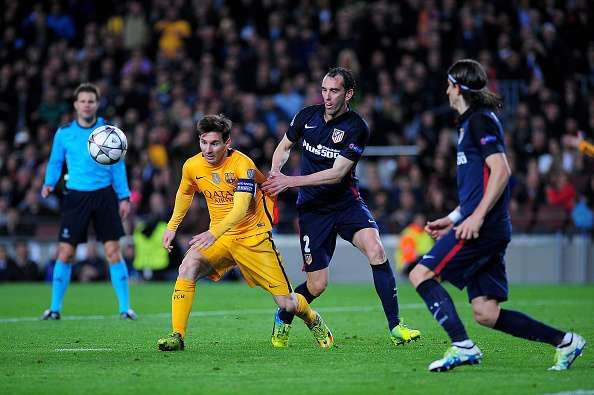 Lionel Messi failed to get past Diego Godin (center).