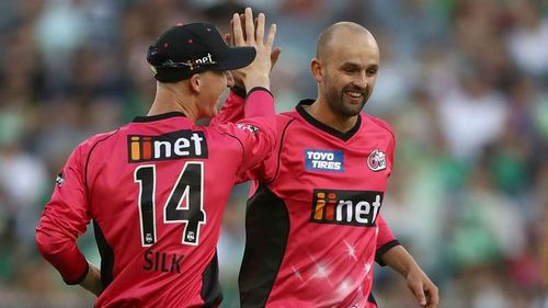 Nathan Lyon celebrates the wicket of Kevin Pietersen with team-mate Jordan Silk